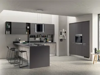 Cucina su misura angolare con penisola Sax in decorativo Concrete Medium e decorativo Grafite con top in laminato di Scavolini